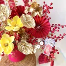 Spring Fortune Flower Box with red and gold elements, including flowers, berries, and coins.