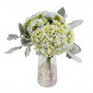 A bouquet of blue and green hydrangeas with fuzzy gray leaves in a pearlescent vase.