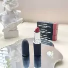 MAC lipstick in Blooming Forest with gift box and floral decor.