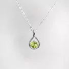 Sterling silver necklace with a teardrop pendant holding a green peridot gemstone.