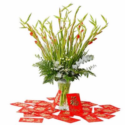 Red gladiolus and baby's breath flower arrangement with red envelopes.