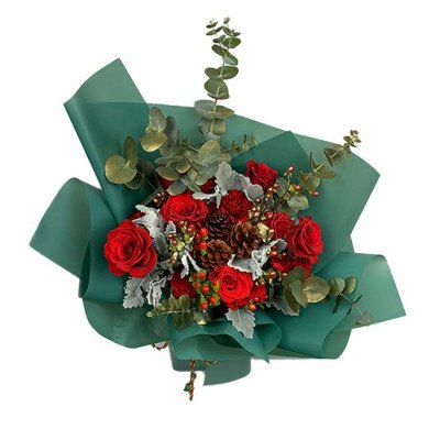 Red roses, carnations, pine cones, and eucalyptus in a green bouquet wrap.