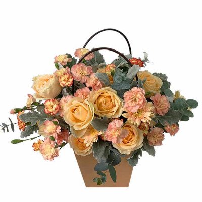 Floral arrangement with peach roses, orange daisies, and carnations in a brown basket.