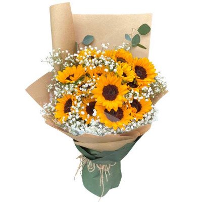 Bouquet of sunflowers, baby's breath, and eucalyptus in kraft paper and green wrap.