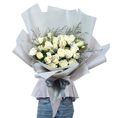 Bouquet of 36 white roses wrapped in light gray paper with a gray ribbon.