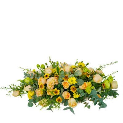 A spray of peach roses, yellow sunflowers, and green foliage on a white background.