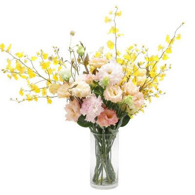 Bouquet of yellow dancing orchids and pink, white, and cream lisianthus flowers in a clear vase.