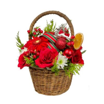 Christmas flower basket with red roses, gerberas, berries, ornaments, and a reindeer figurine.
