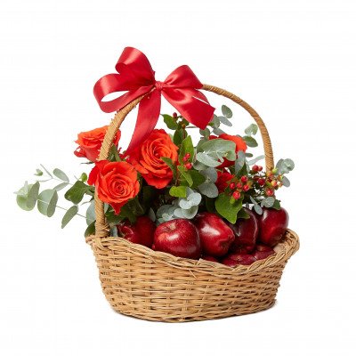 Basket of red apples and orange roses tied with a red bow.