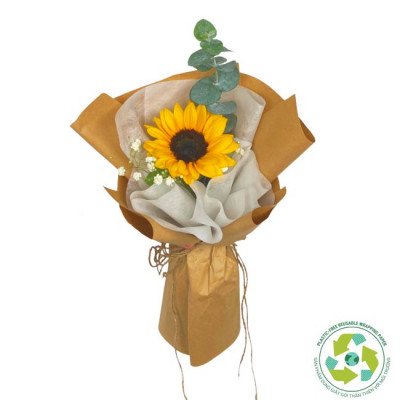 Sunflower bouquet wrapped in brown paper with eucalyptus and baby's breath.
