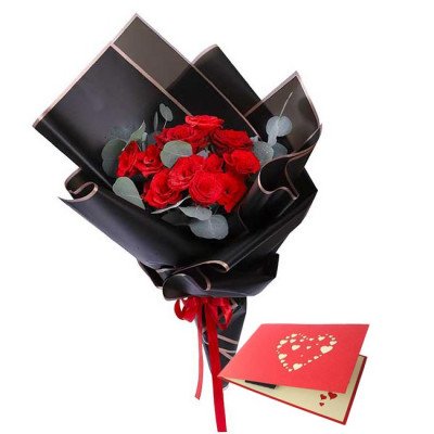 Bouquet of red roses in black paper with a red heart-themed card.