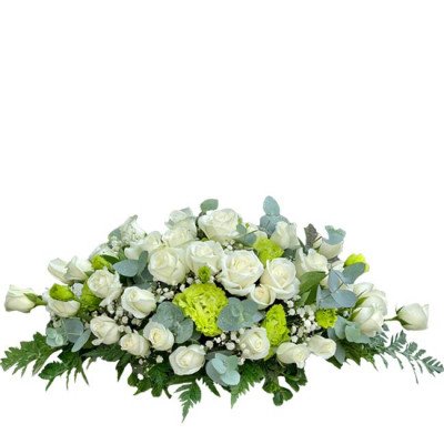 White roses with green accents and eucalyptus in a low, wide arrangement.