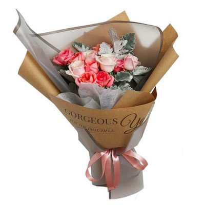 Pink roses in a kraft paper bouquet with "Gorgeous You" text, tied with a ribbon.