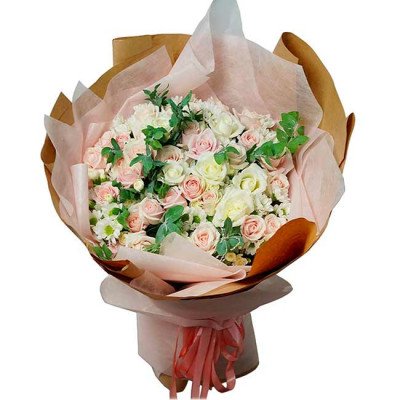 A bouquet of pink and white roses with greenery, wrapped in brown and pink paper and tied with a pink ribbon.