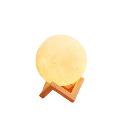 Illuminated moon-shaped essential oil lamp on a wooden stand.