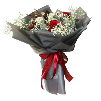 Bouquet of red roses, white carnations, and baby's breath in grey paper with a red ribbon.