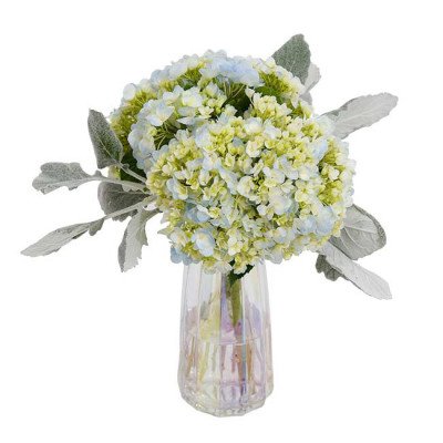 A bouquet of blue and green hydrangeas with fuzzy gray leaves in a pearlescent vase.