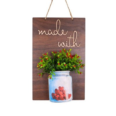 Wooden board with "made with" text, and a jar of flowers and hearts.
