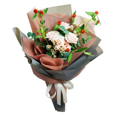 Bouquet of pink roses, eucalyptus, and globe amaranth flowers wrapped in brown and gray paper.