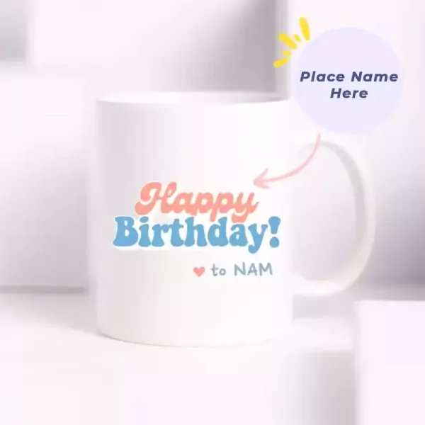 White ceramic mug with "Happy Birthday! ❤️ to NAM" design and a purple circle with "Place Name Here".