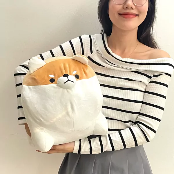 Chonky Shiba plush toy, 50cm, with brown and white fur, held by a person wearing a striped shirt.
