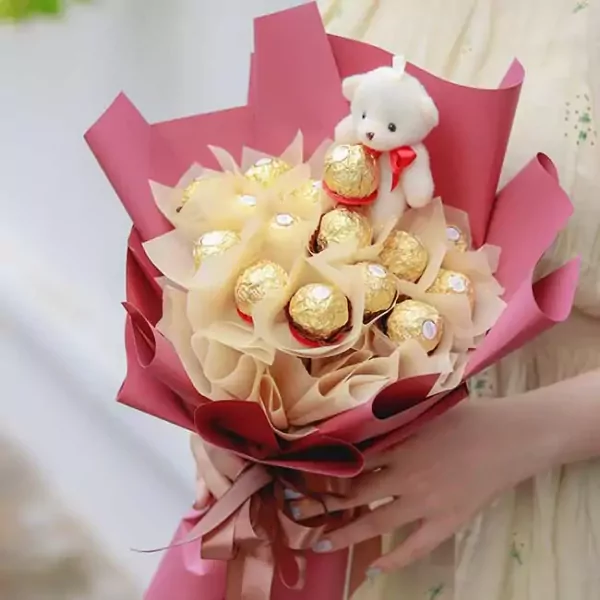 Chocolate bouquet with a teddy bear topper and Ferrero Rocher chocolates.