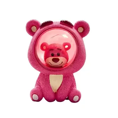 Pink Lotso teddy bear night light with a clear dome and red interior lighting.