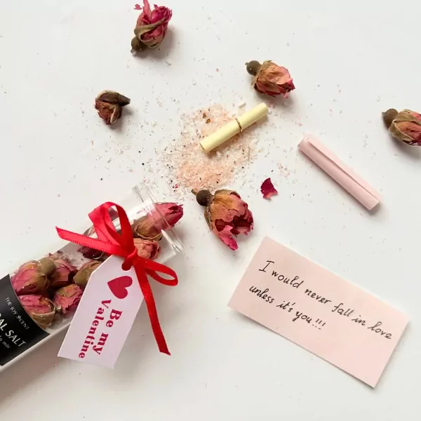 Valentine gift set with dried roses, bath salt, and love notes.