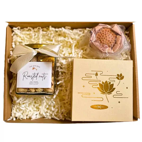 Gift box with jar of roasted nuts, lotus-shaped candy, and a decorative box with lotus design.
