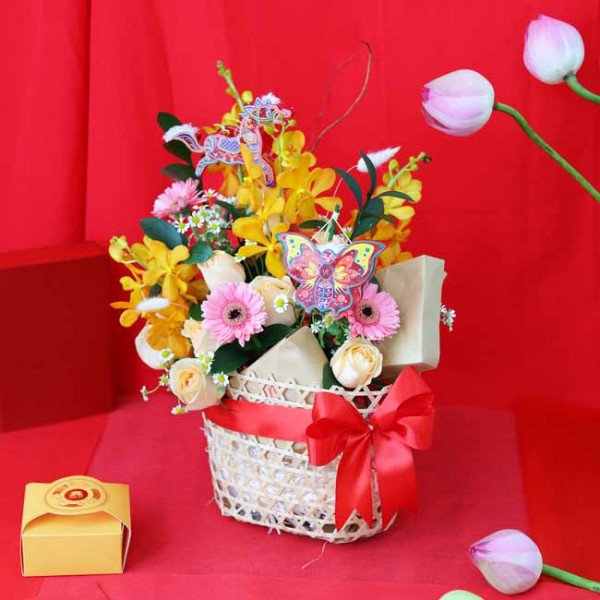 Mid-Autumn Glory flower basket with orchids, roses, daisies, and decorative elements.