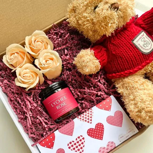 Gift box with teddy bear, soap roses, and "Lychee Rose" candle.