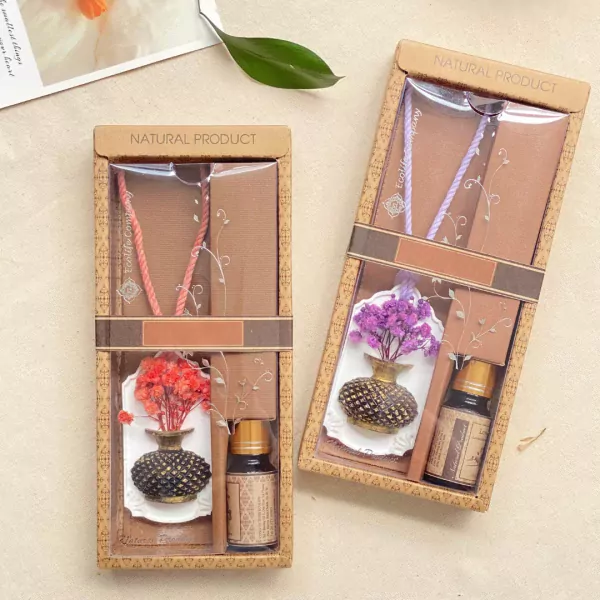 Gift set with dried flowers, aroma stone, and essential oil bottles.