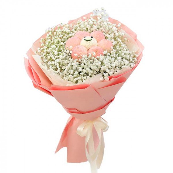 Bouquet of baby's breath with pink ping pong chrysanthemums arranged like a smiling flower.