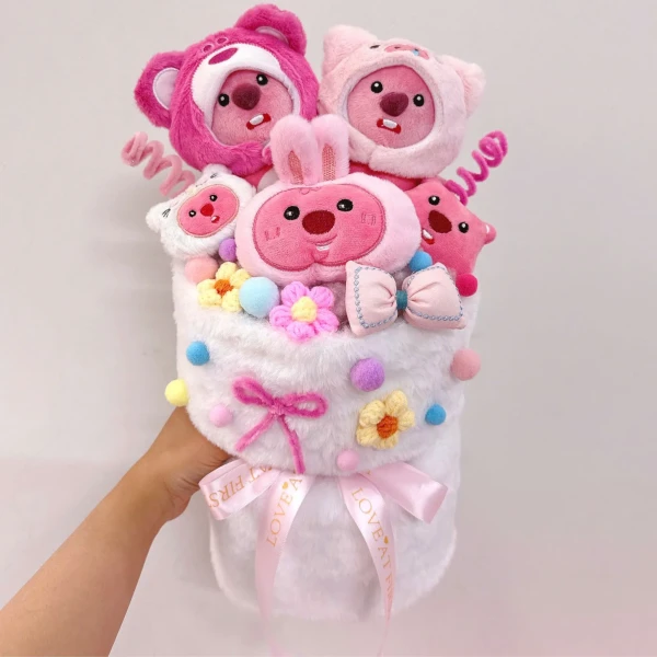 Pink plush bouquet with fuzzy characters, flowers, and bows.