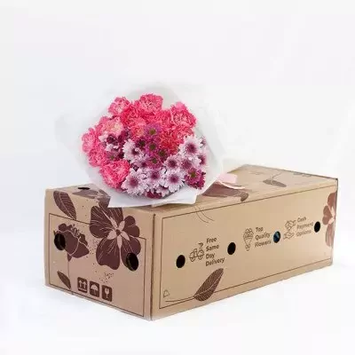 Pink carnation and chrysanthemum bouquet on a flower delivery box.