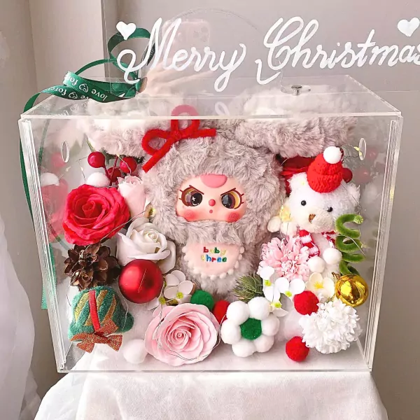 Christmas bunny box with plush toys and flowers, decorated with "Merry Christmas."