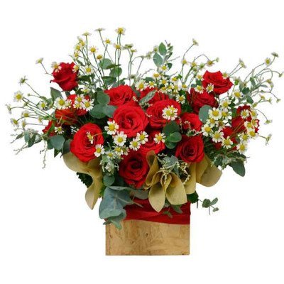 Red roses and daisies arranged in a wooden box, tied with a red ribbon.