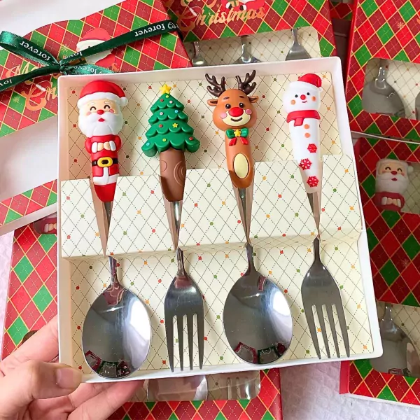 Christmas cutlery set with Santa, tree, reindeer, and snowman designs.