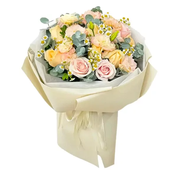 Bouquet of pink and cream roses, lisianthus, and chamomile flowers.