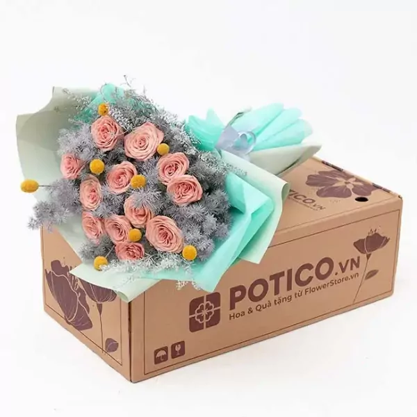 Bouquet of pink cappuccino roses, yellow craspedia, and grey foliage in a gift box.