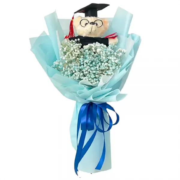 Graduation teddy bear bouquet with baby's breath flowers, wrapped in light blue paper and tied with a blue ribbon.