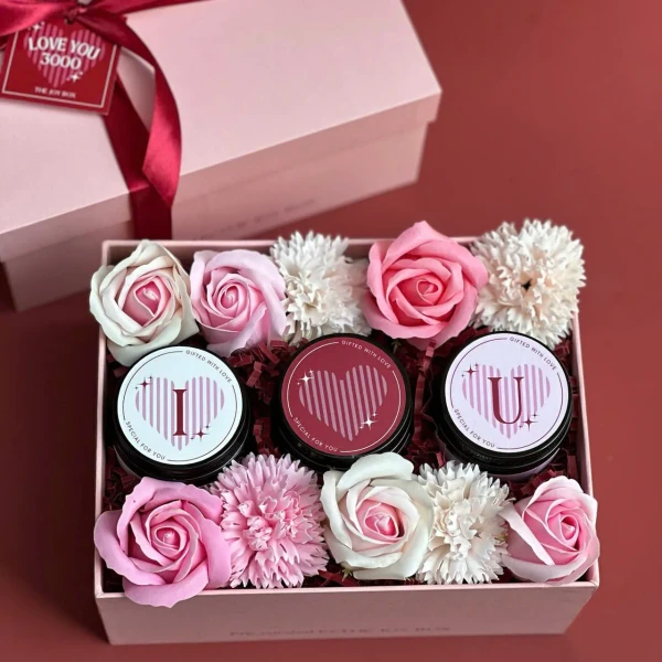 Pink gift box with three candles and faux roses, "Eternal Vows Gift Box" label.