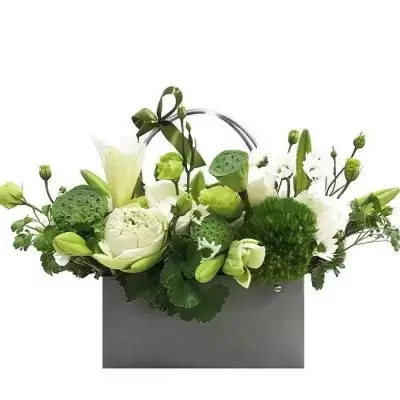White and green floral arrangement in a grey box, featuring lotus pods, lilies, and roses.