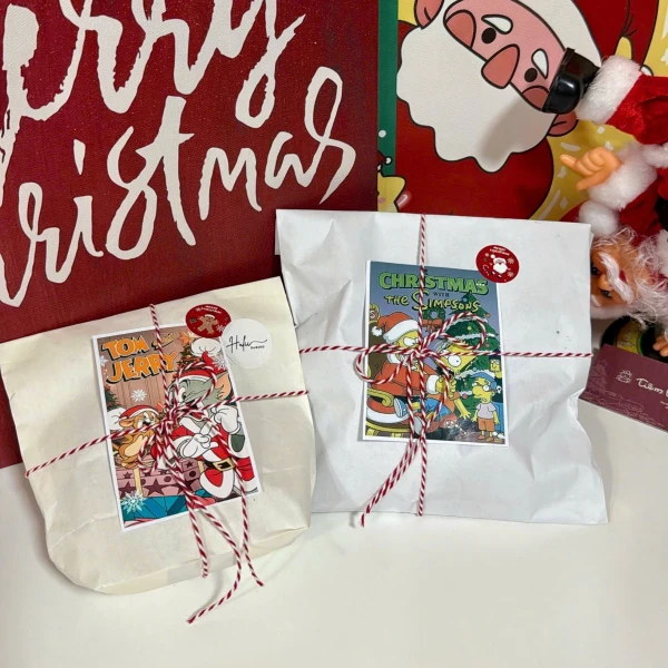 Christmas-themed cookie boxes with Tom & Jerry and The Simpsons decorations.