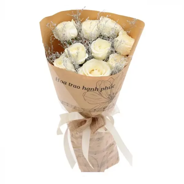 Bouquet of white roses with brown paper wrapping and white ribbon.