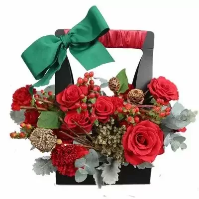 Black basket with red roses, carnations, berries, pinecones, and a green bow.