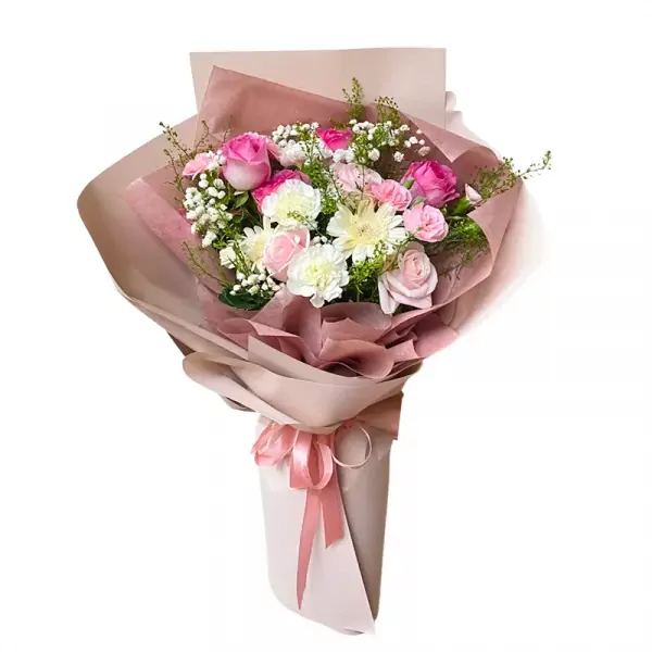 Pink and white floral bouquet with roses, carnations, and baby's breath, wrapped in soft pink paper.
