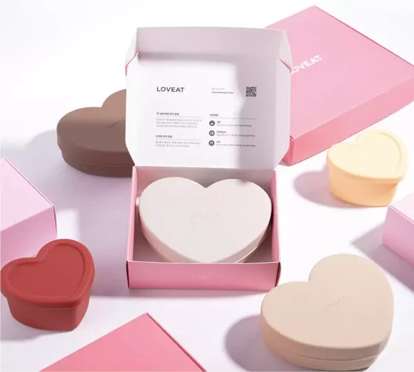 Heart-shaped lunchboxes in various colors on a white background.