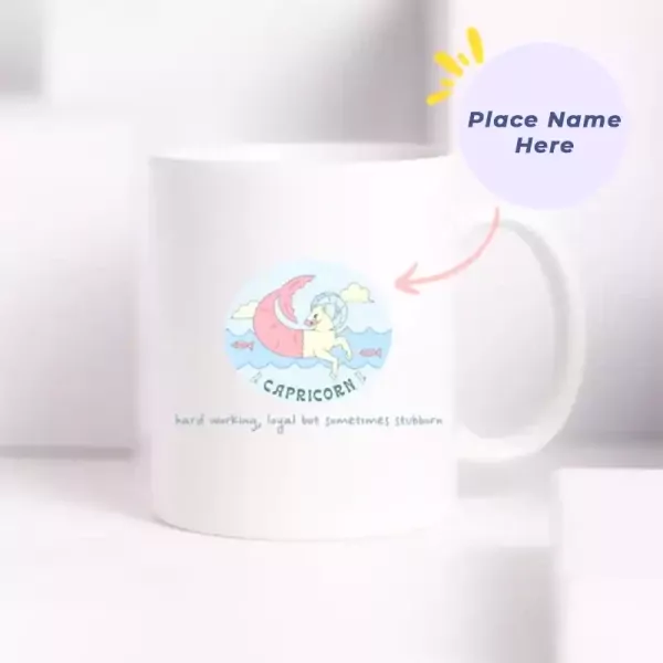 White ceramic mug with a Capricorn zodiac design and a pink crescent moon.