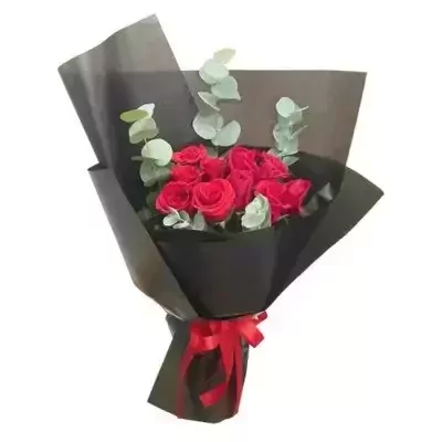 Bouquet of red roses wrapped in black paper with a red ribbon.